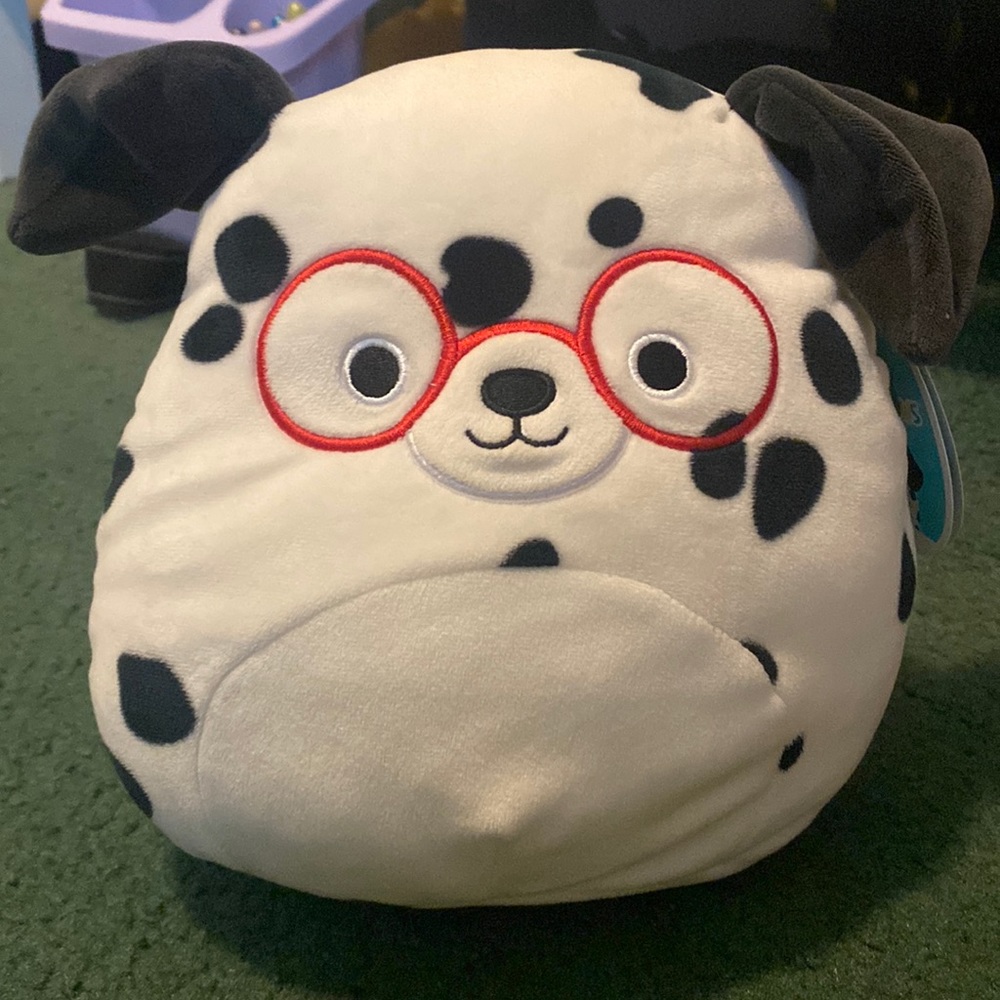 Justin the dog squishmellow, with red glasses